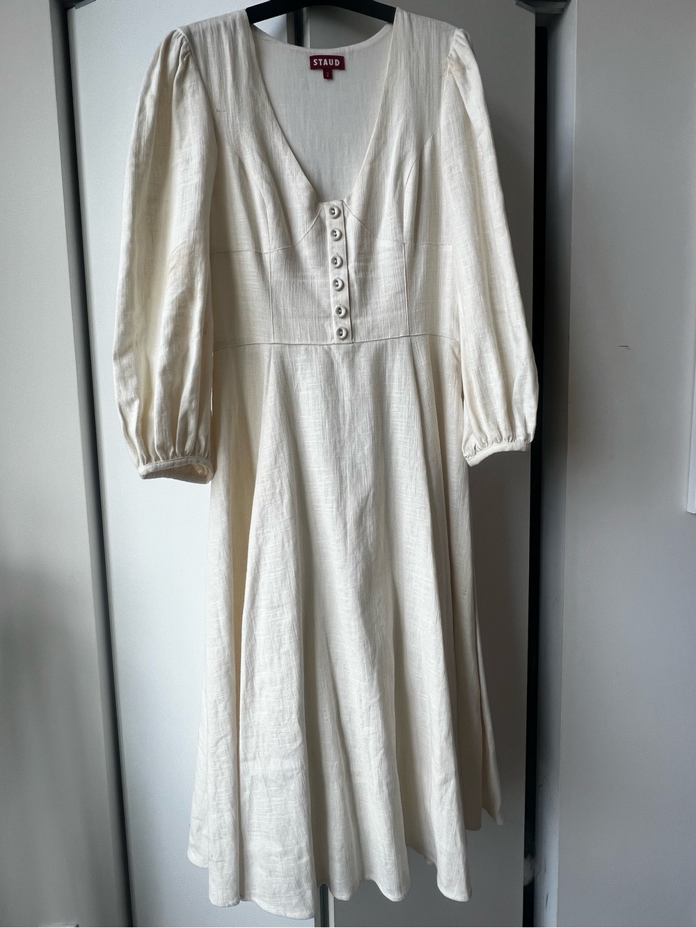 STAUD Birdie Dress: Ivory V‑Neck Midi Dress with Button Front